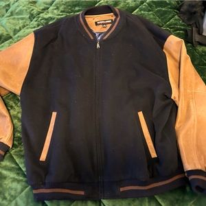 XL stadium jacket. Sleeves and trimmed leather.Quilted satin inside w 2 pockets